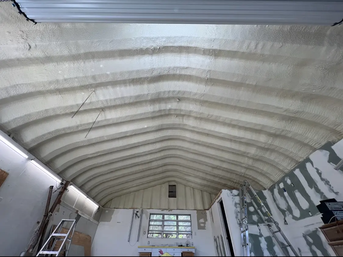 Spray polyurethane foam applied to the underside of a metal roof deck in Spring Lake